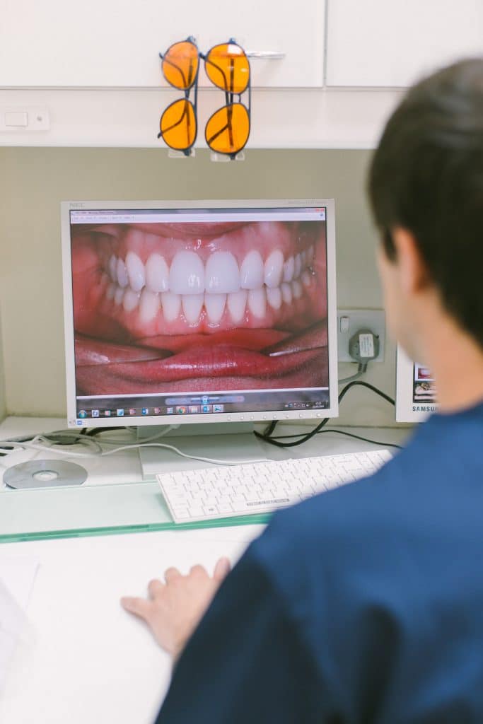 Dentist viewing smile makeover on screen
